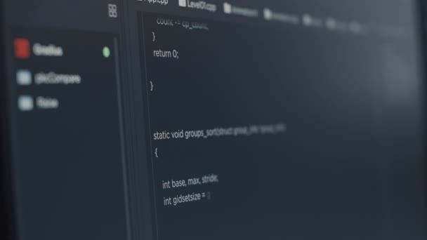 Closeup of computer screen of software developer typing programming language - Кадры, видео