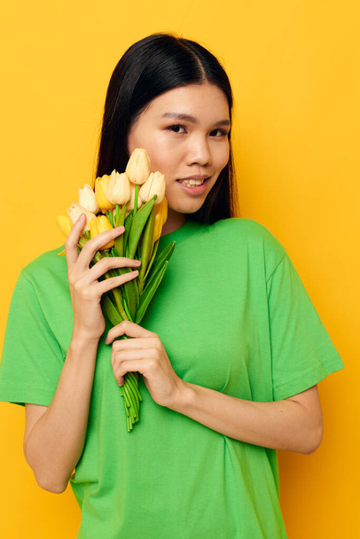 Charming young Asian woman bouquet of flowers romance spring posing isolated background unaltered - Fotografie, Obrázek