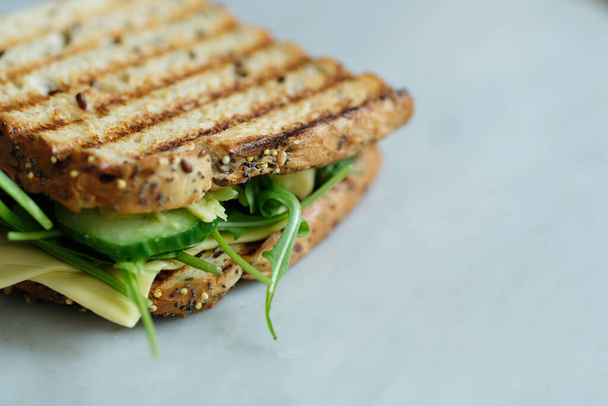 Delicious vegetarian sandwich on the table - Photo, image