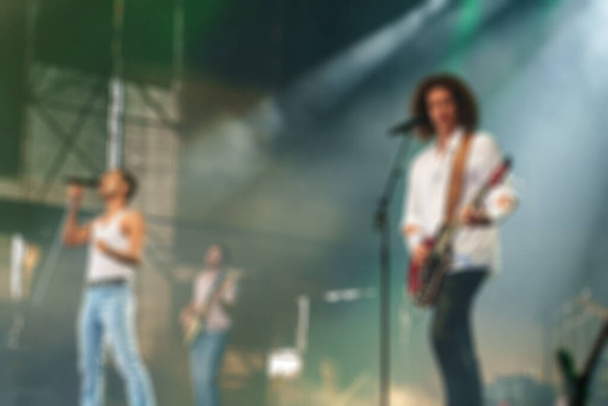 Musical band performing live on the stage. Blurred image. - Photo, Image