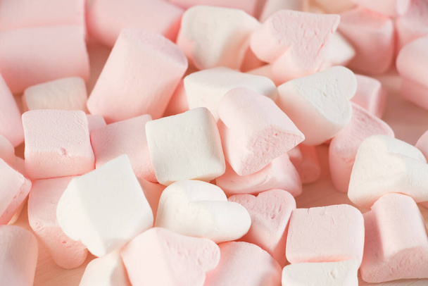 Sweet marshmallows on a pink pastel background. Childhood and birthday concept. - Foto, Imagen