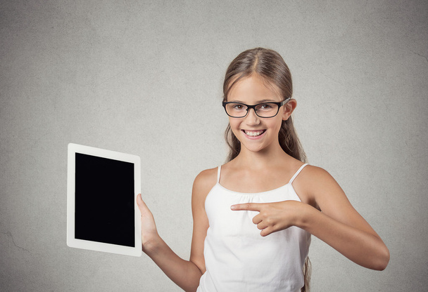  teenager girl shows tablet with touchscreen display - 写真・画像