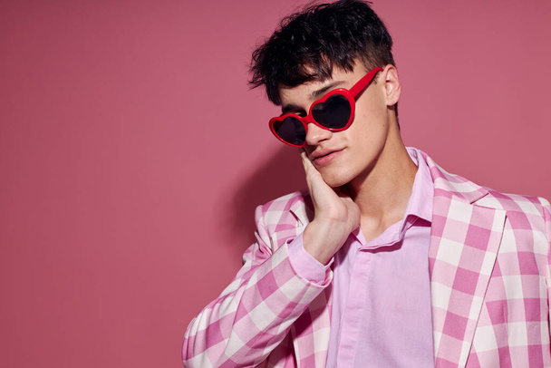 Photo of romantic young boyfriend self confidence pink plaid blazer fashion posing Lifestyle unaltered - 写真・画像
