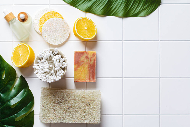 Eco bath accessories. Natural brushes, soap, sponges and organic skin care products. White bathroom background, copy space, top view. Zero waste concept. - Фото, зображення