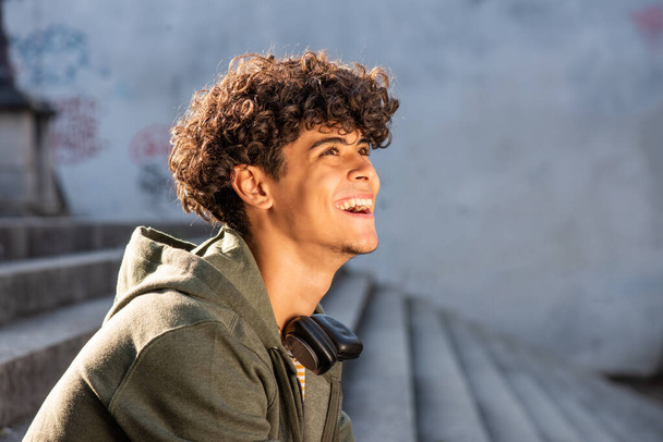 Close up side portrait happy young North African man  - Φωτογραφία, εικόνα
