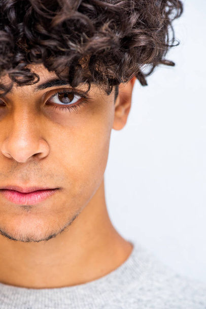 Close up half face portrait young man with curly hair - Foto, Imagen