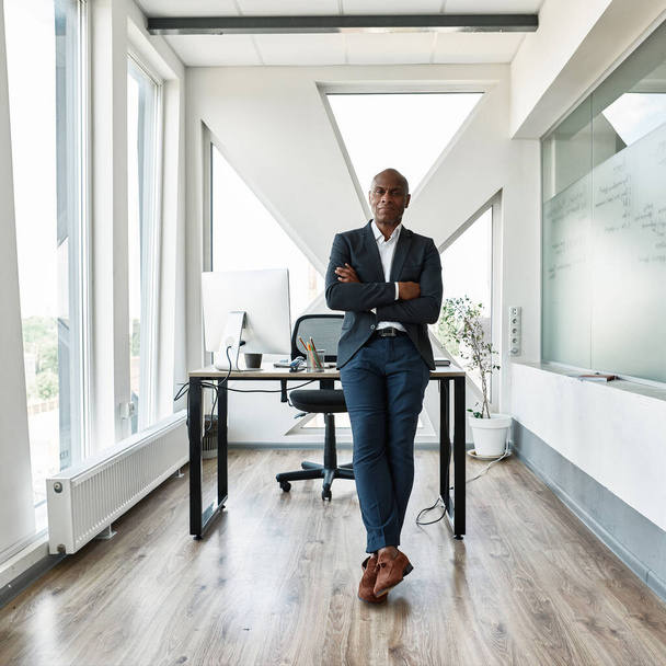 Serious black male businessman with crossed arms - Photo, image