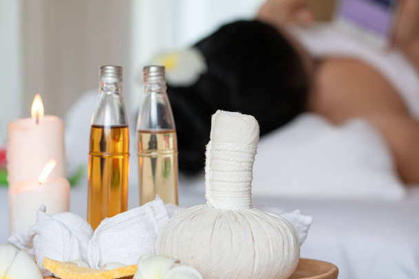 Spa still life with oil bottle, compress, aroma lotion and salt on wooden tray by close up	 - Foto, Imagem