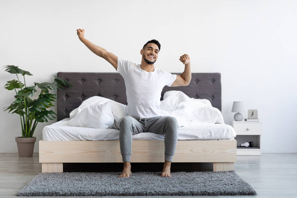Handsome Happy Arab Guy Waking Up In The Morning, Stretching In Bed - Fotoğraf, Görsel