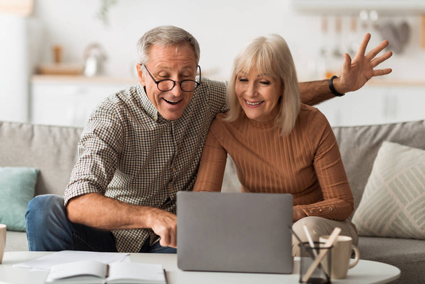 Senior Spouses Making Video Call Talking To Laptop At Home - Zdjęcie, obraz