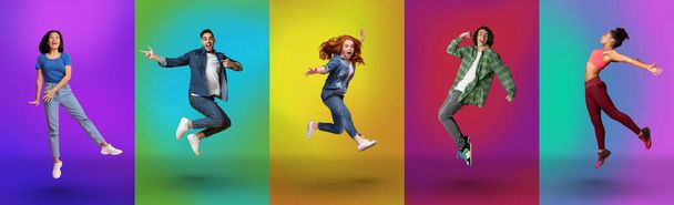 Excited millennial diverse people jumping up, flying in air, enjoying freedom over bright neon studio backgrounds - Photo, image