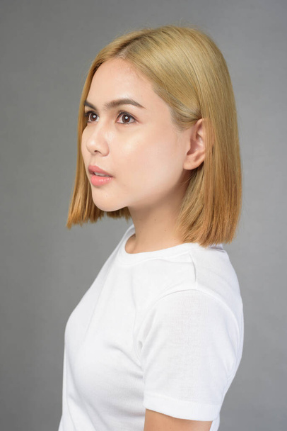 A portrait of short blonde hair woman in studio - Photo, Image
