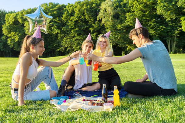 Teenage birthday party picnic on the grass in the park - Φωτογραφία, εικόνα