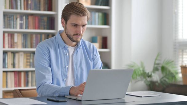 Man Working on Laptop in Office - Photo, Image