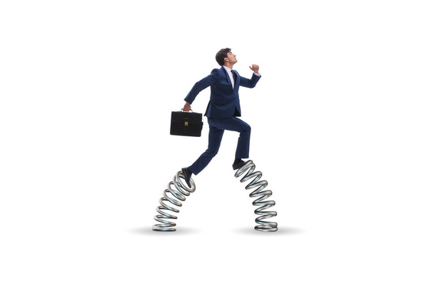 Businessman jumping high on springs - Photo, Image