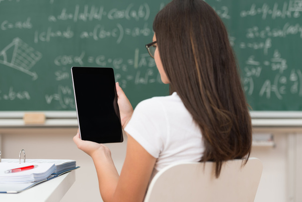 Young woman studying in class using a tablet - Photo, image