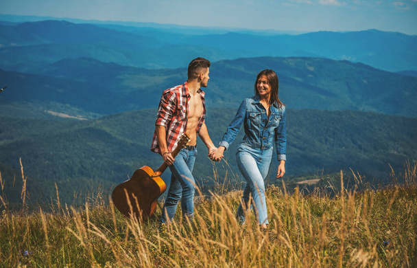 Young couple tourist. Camping lovers. Couple in love, lovers tourist walking. Young tourist couple travellers hiking in nature, walking and talking. - 写真・画像