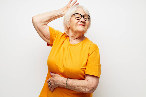 elderly woman in casual t-shirt and glasses close-up - Photo, image