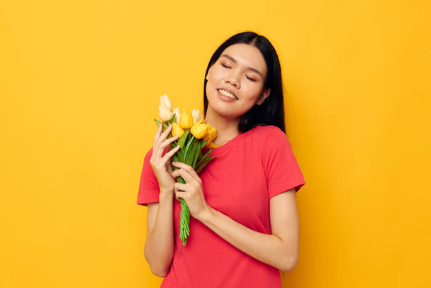 Asian woman yellow bouquet of flowers gift - Zdjęcie, obraz