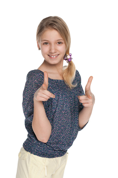 Smiling girl shows her fingers forward - Zdjęcie, obraz