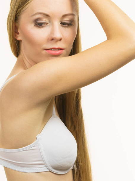 Young long hair blonde woman small boobs wearing bra. Female breast in lingerie. Bosom, bra fitting and underwear concept. - Φωτογραφία, εικόνα