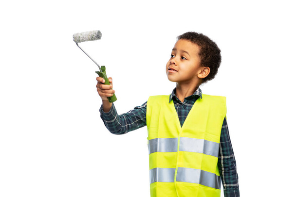 little boy in safety vest with paint roller - Zdjęcie, obraz