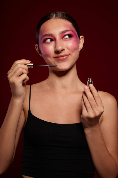 Sexy brunette woman bright makeup posing fashion emotions cosmetics cropped view unaltered - Valokuva, kuva