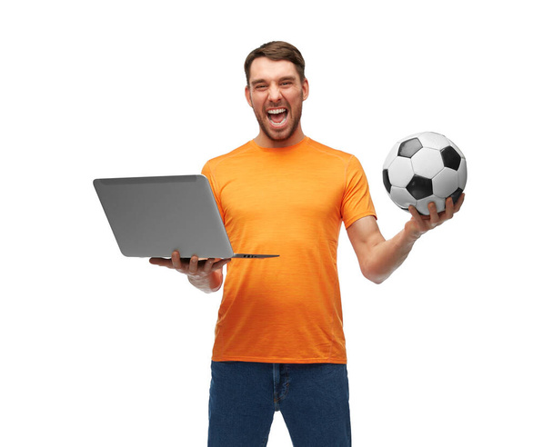 man or football fan with soccer ball and laptop - Fotó, kép