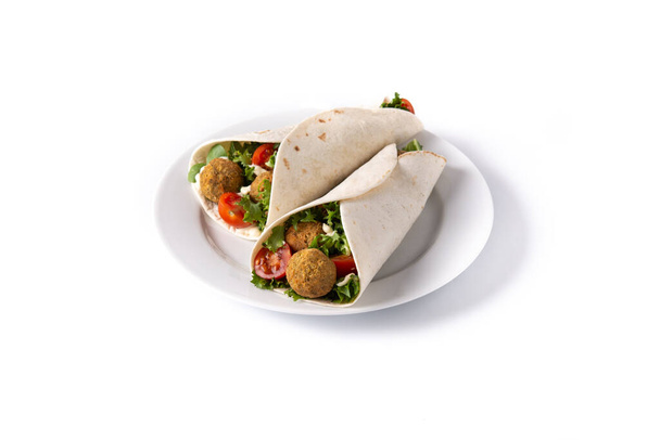 Tortilla wrap with falafel and vegetables isolated on white background - Fotó, kép