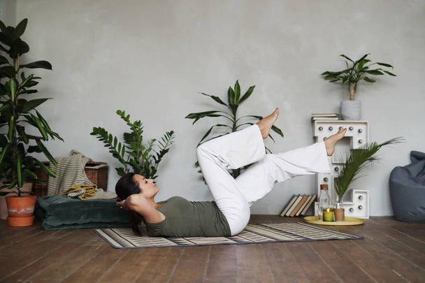Woman doing yoga at home - Photo, Image