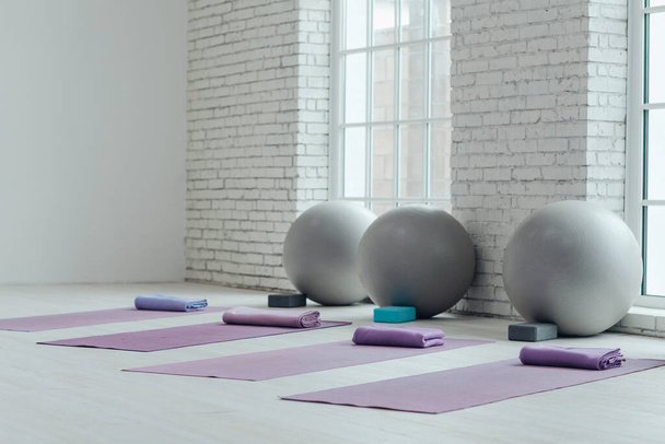 Yoga mats and balls. Yoga accessories, hall, room. - Photo, Image