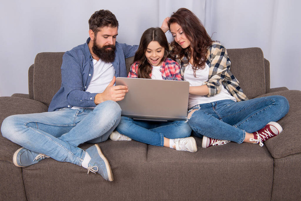 parents with amazed kid use pc at home, shopping - Φωτογραφία, εικόνα