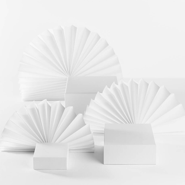 Abstract white stage template with three podiums on table for showing, presentation cosmetic product, goods, advertising with soft light paper fans in elegant fashion modern style, front view, square. - Φωτογραφία, εικόνα