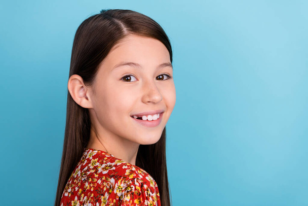 Profile side photo of young lovely preteen girl good mood clever isolated over blue color background. - Foto, Imagen