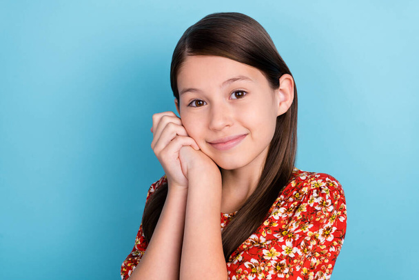 Profile side photo of young attractive lovely girl arms touch cheeks isolated over blue color background. - Foto, imagen