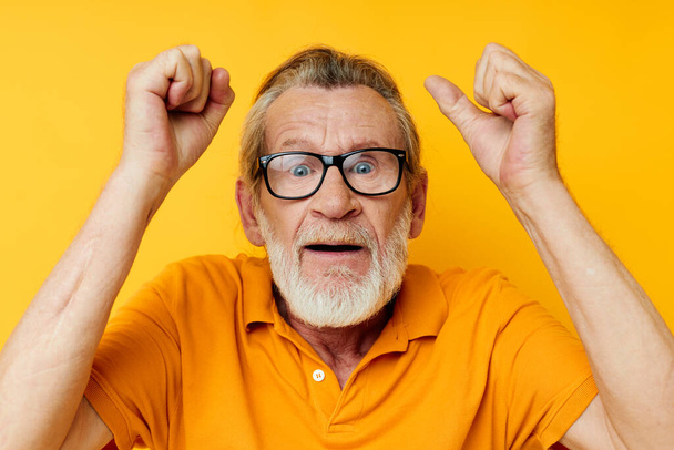 Portrait of happy senior man with a gray beard in glasses cropped view - Фото, изображение