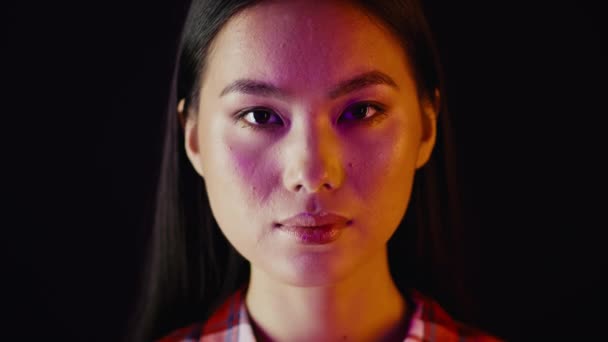 Unedited Shot Of Young Asian Female Face Looking At Camera - Felvétel, videó