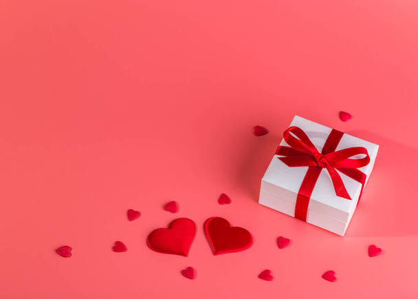 Valentine's day background with red hearts and gift. Copy space.  - Φωτογραφία, εικόνα