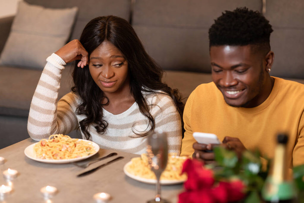 Jealous Black Wife Picking At Husbands Phone During Date Indoor - Photo, Image