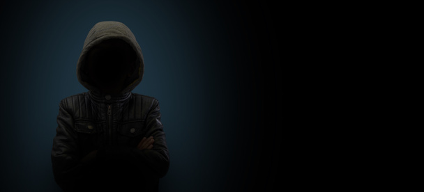Hacker with hood - dark web and security concept. - 写真・画像