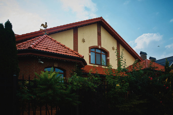 Cute Cottage Home. Cottage Style House. Two-storey house close-up - Фото, зображення