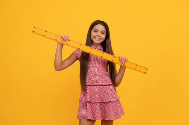 happy teen girl study math in school hold ruler, education - Zdjęcie, obraz