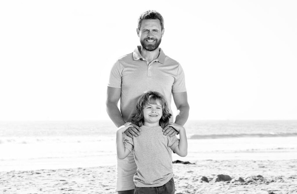 family travel weekend and vacation. childhood and parenting. daddy with kid boy in sea - Photo, Image
