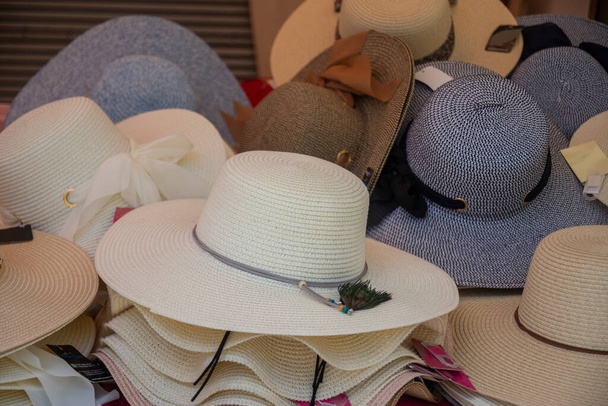 Many hats from the sun. Women's designer hats from the sun of different colors. Beach hats for summer, Design of women's beach hats. - Φωτογραφία, εικόνα