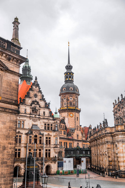 Dresden, Germany - December 19, 2021: Hausmannsturm tower and Dresden Cathedral Catholic Court Church in the old town or Altstadt of Dresden, Saxony, Germany. - Φωτογραφία, εικόνα