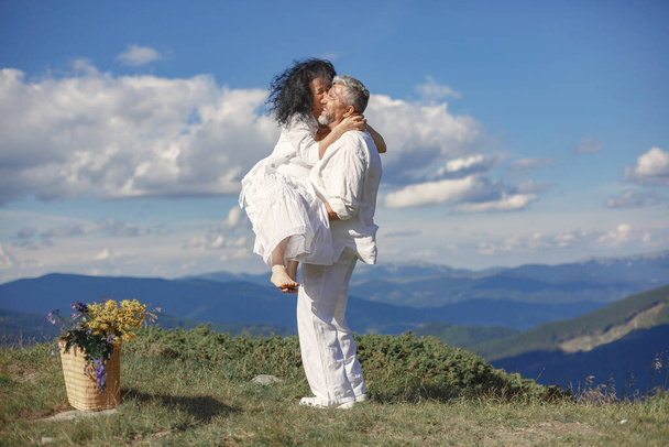 Adult couple walk in the mountains - Foto, imagen