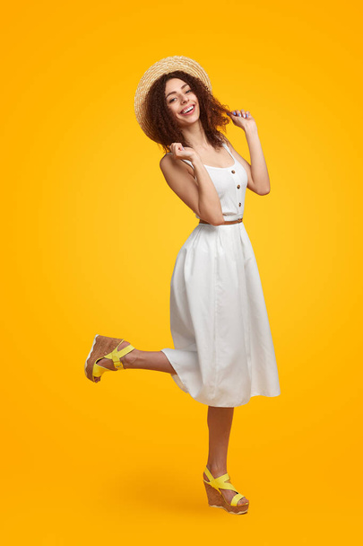 Carefree woman in summer outfit in studio - Foto, Imagem
