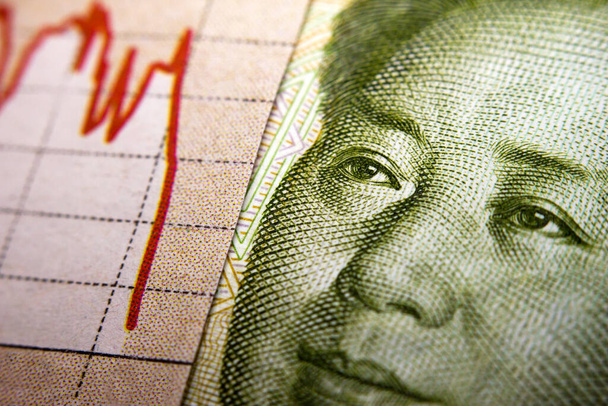Stock market declining chart and Yuan banknote - Photo, Image