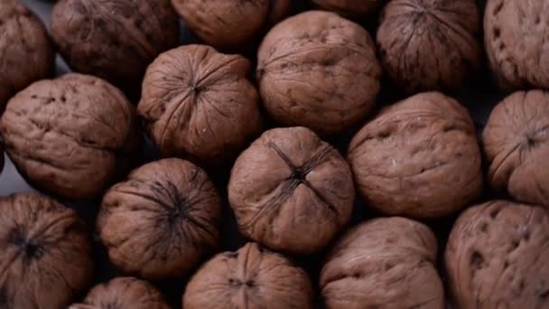 Close-up of fresh Italian walnuts, rotating top view. Foods rich in nutrients. Concept of dried fruit - Filmati, video