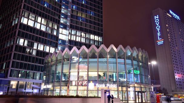 Warsaw, Poland. 11 January 2022. Rotunda of PKO Bank Polski. Modern building in city center at night. - Fotó, kép